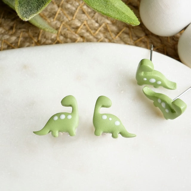 Green deals dinosaur earrings