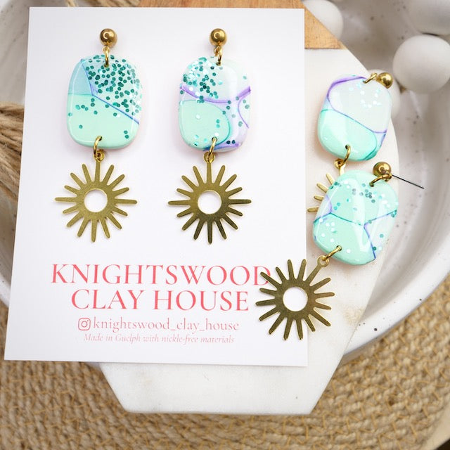 Duke Dangles in Mermaid Bubbles with Brass