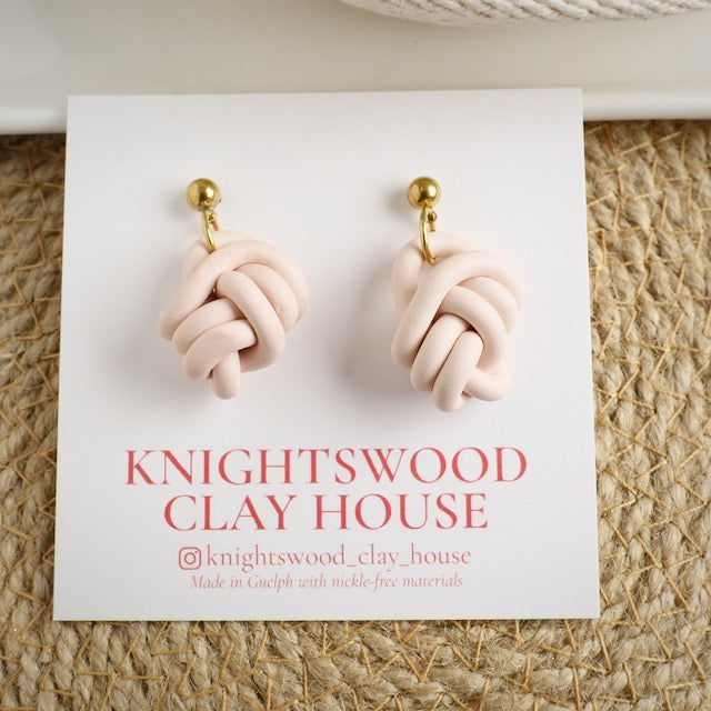 Knot Dangles in Light Coral